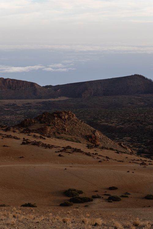 Free A breathtaking view of an arid landscape featuring rocky terrain under a clear sky. Stock Photo
