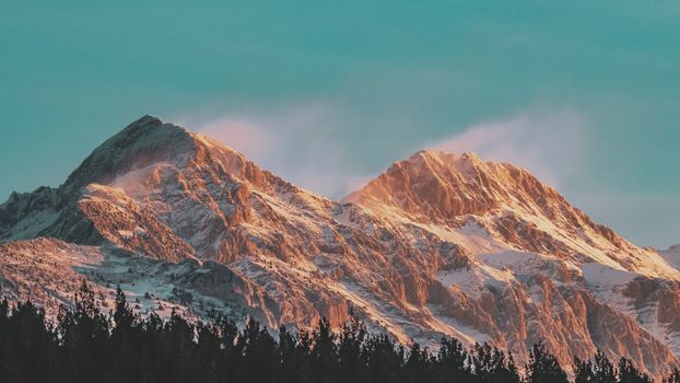 Majestic snow-covered mountains in Niğde, Türkiye at sunrise, offering a breathtaking winter landscape.