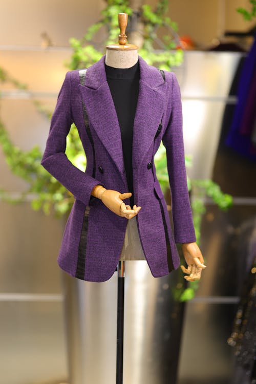 A Purple Tailored Jacket Hanging on a Mannequin 