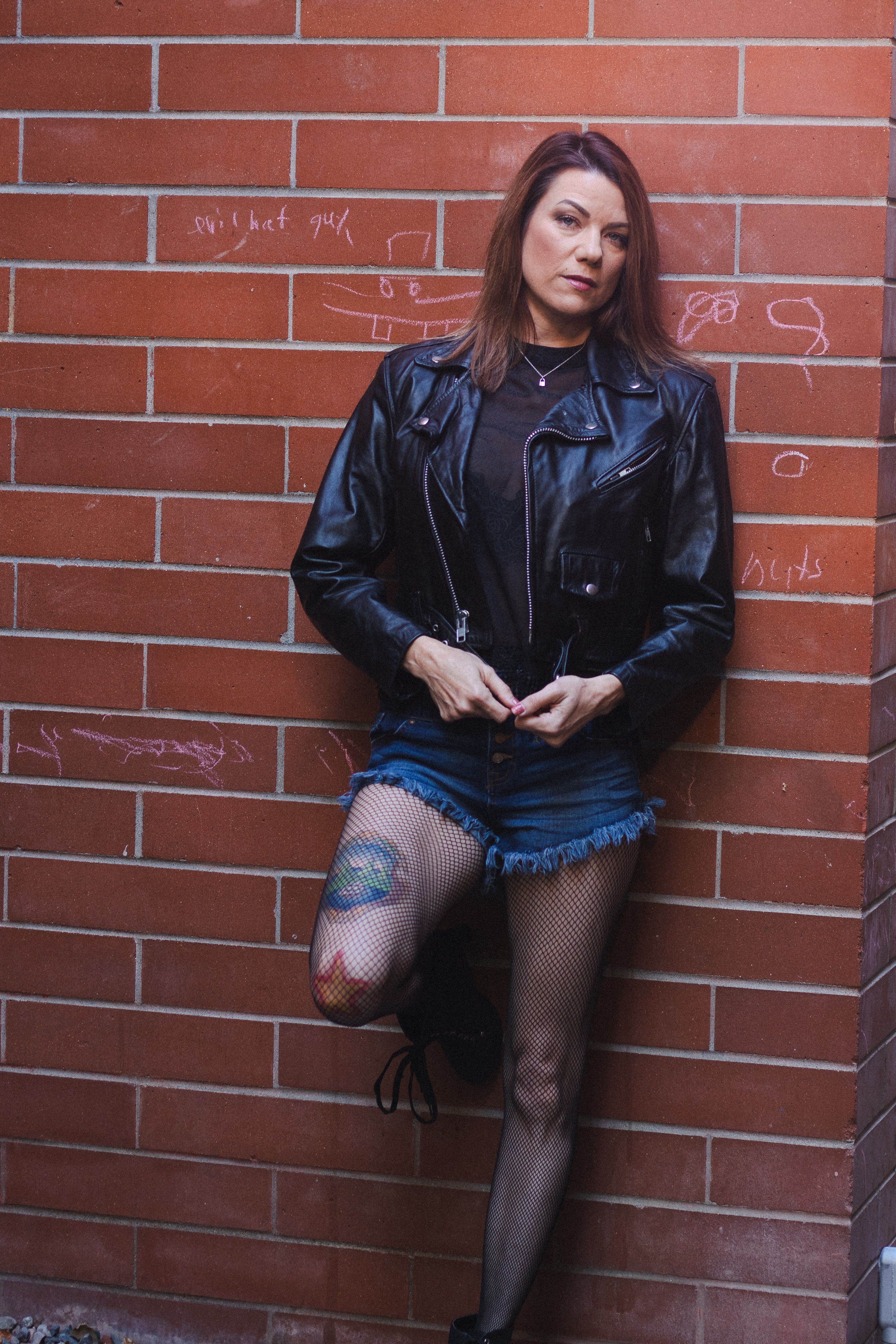 Woman in Leather Jacket and Denim Shorts · Free Stock Photo