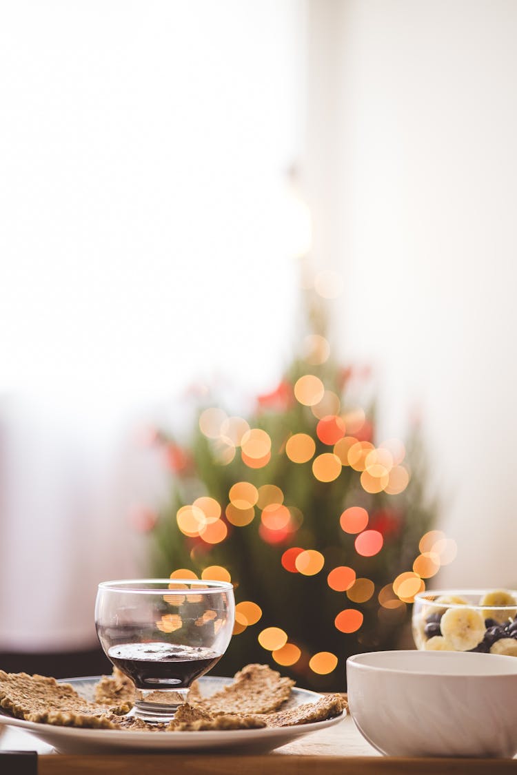 Dishes On The Table On The Background Of A Christmas Tree