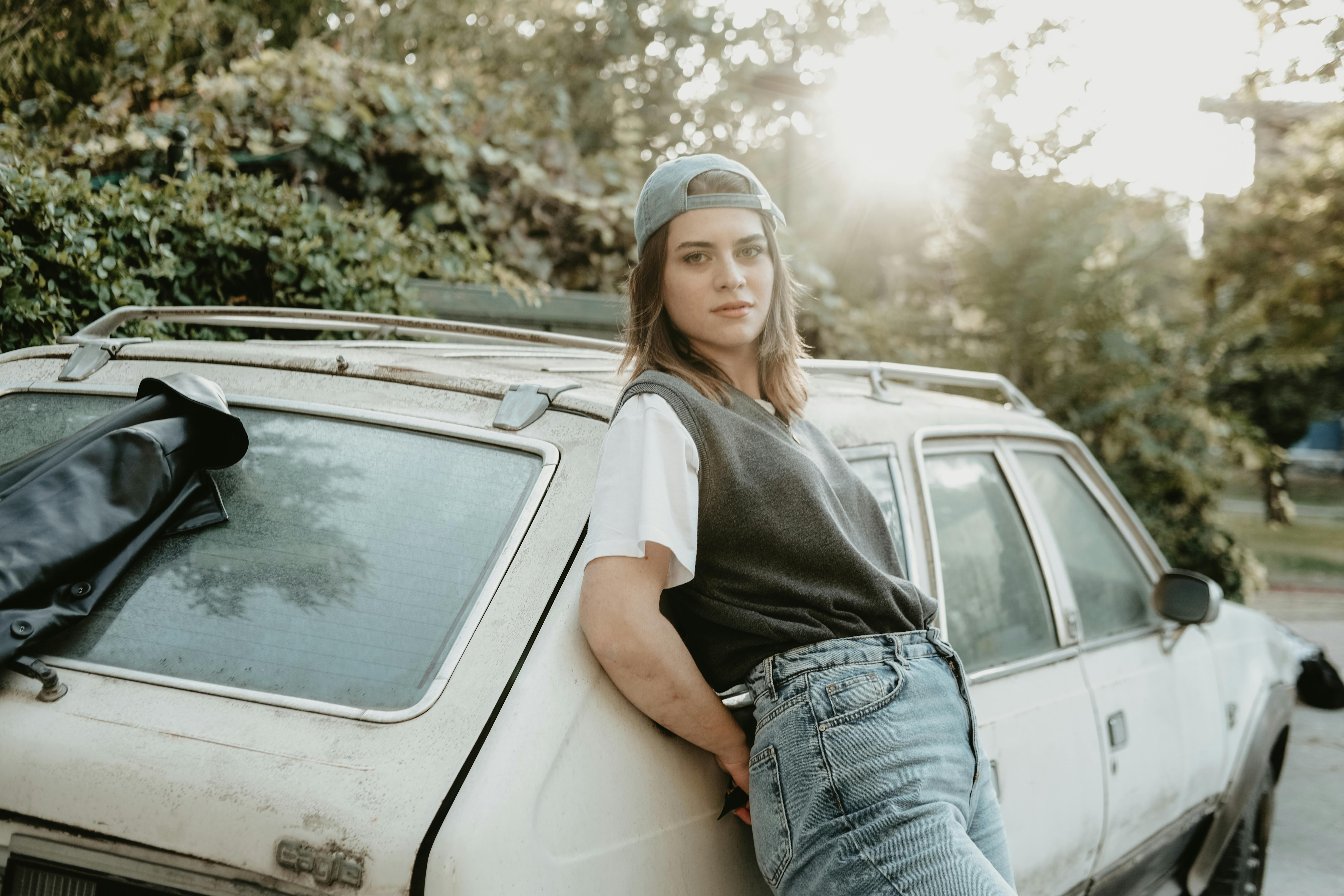 Woman Leaning on Pink Vehicle · Free Stock Photo