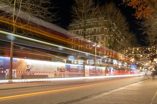 Lights of Passing Cars on the Street at Night