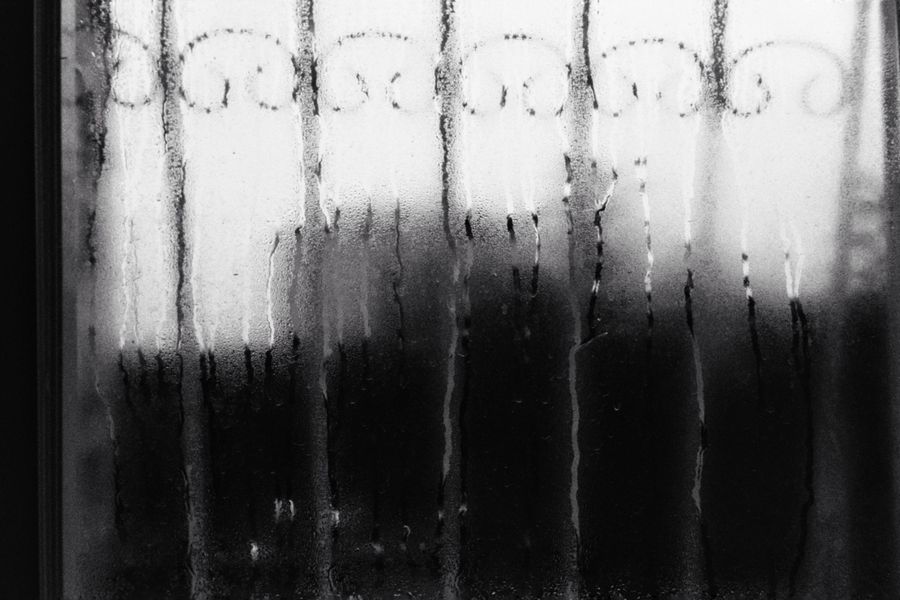 Stock photograph of a window covered with condensation