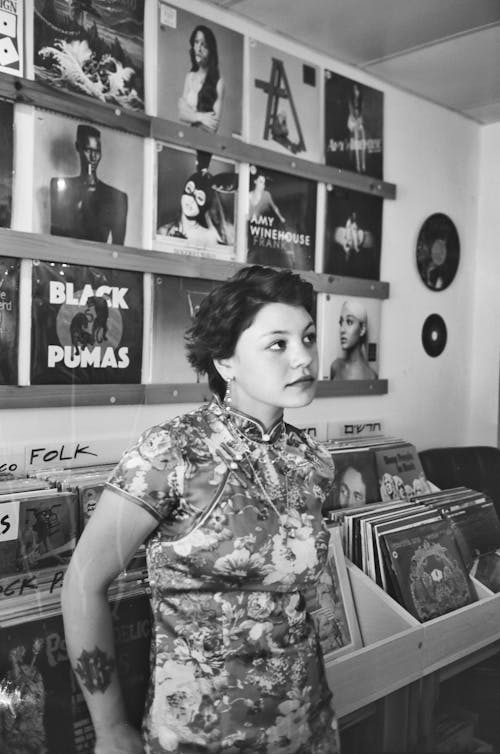 Free Woman in a Music Shop in Black and White  Stock Photo