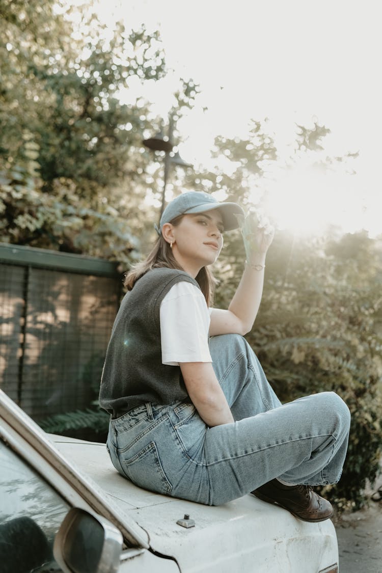 Girl Sitting On A Car 