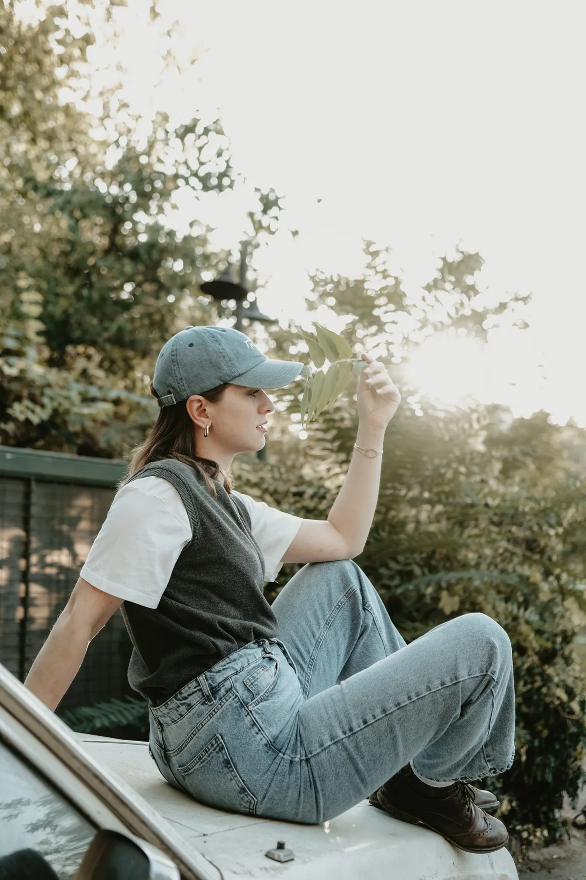 Woman sitting outdoors, casual