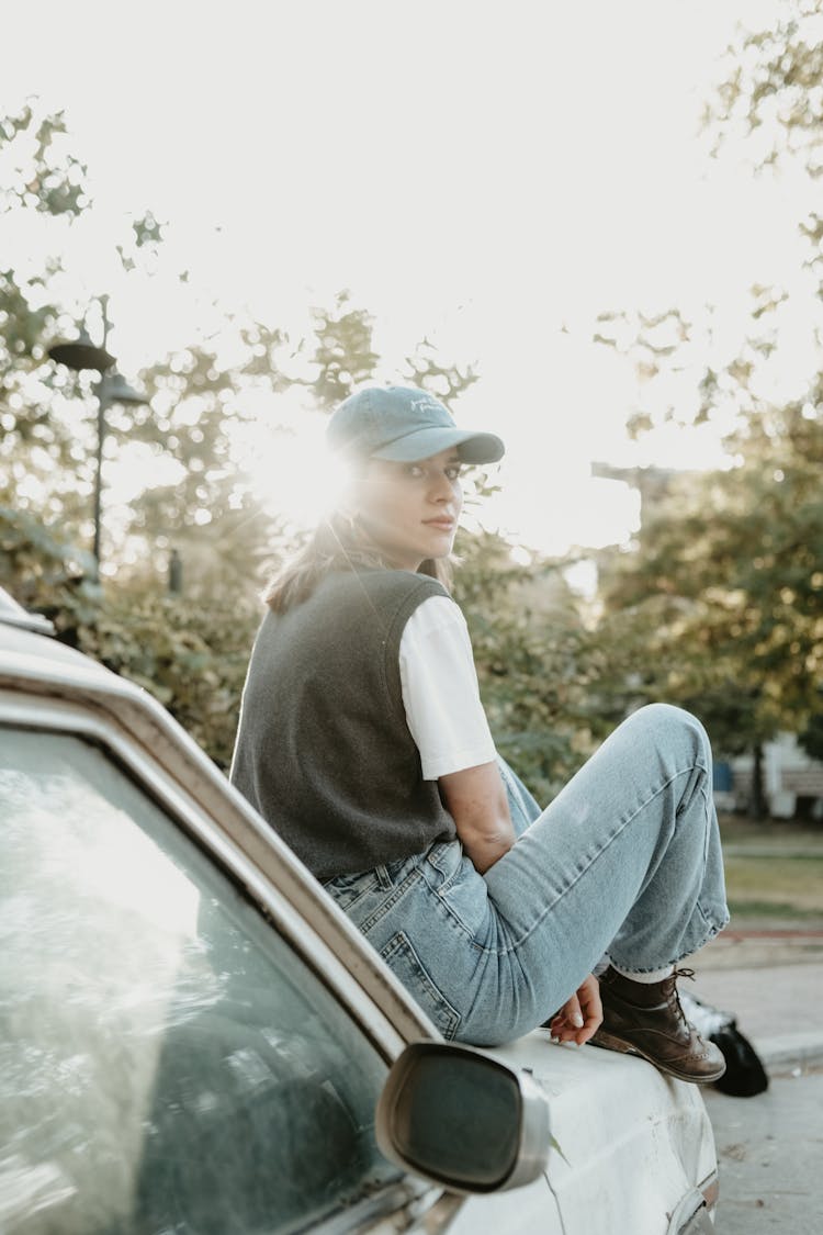 Girl Sitting On A Car 