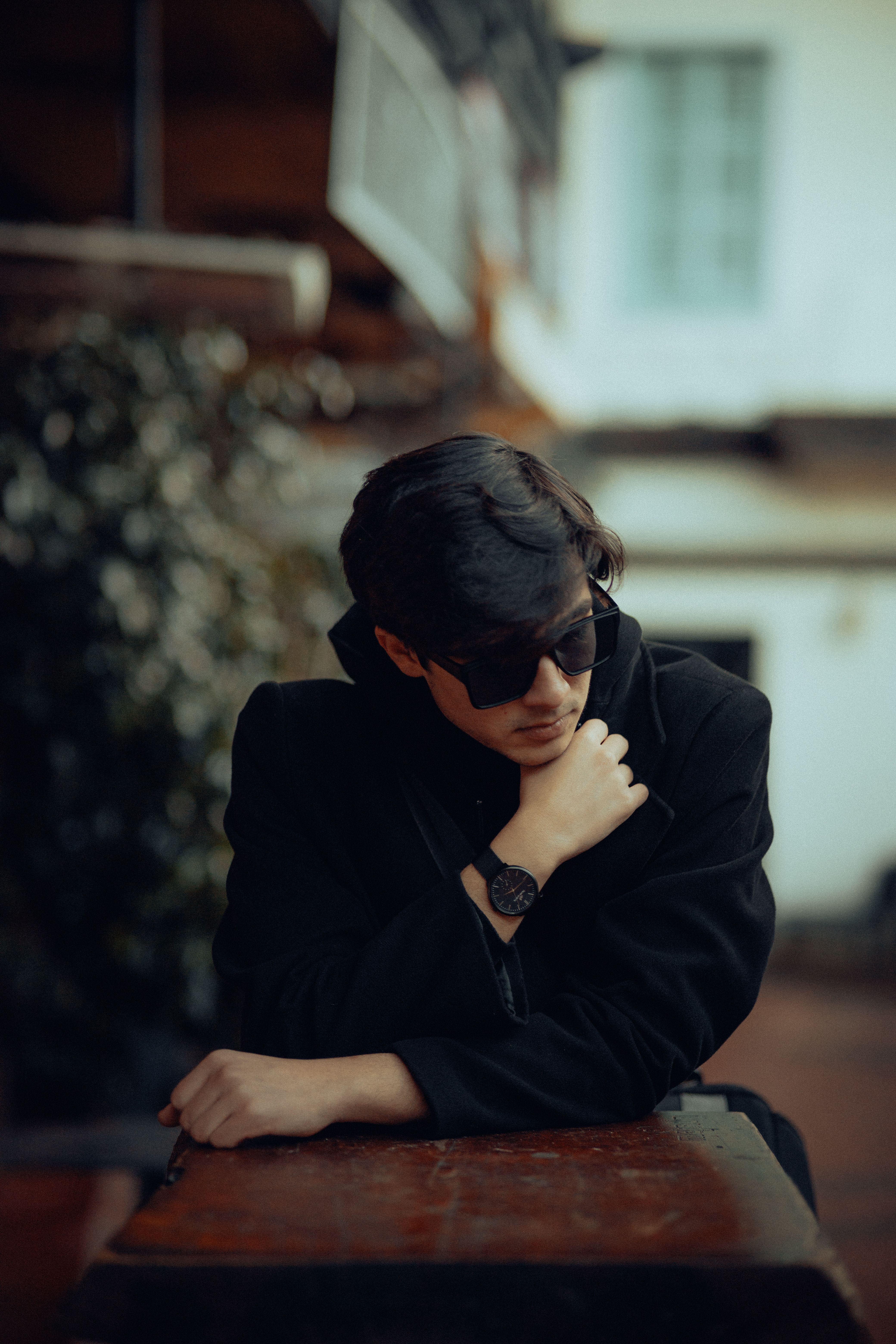 Pensive Model in a Black Coat Posing in Front of a Building · Free ...