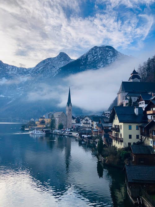Old Houses and a Church at a Lake Shore in Hallstatt, Austria