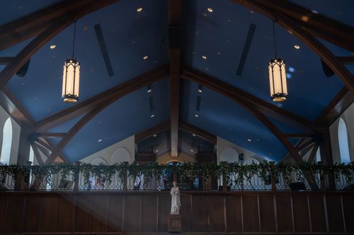 Free A beautifully decorated church interior in winter, featuring festive lights and garlands. Stock Photo