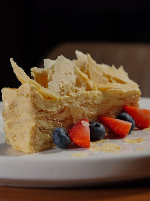 Cream Cake with Fruits Served in a Restaurant 