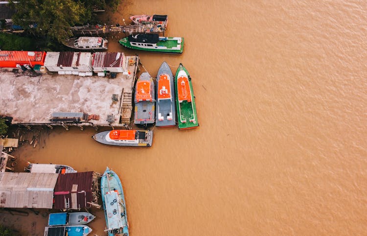 Motorboats Moored On River