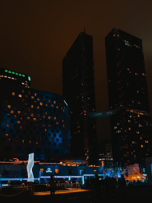 Illuminated Modern Skyscrapers in City at Night 