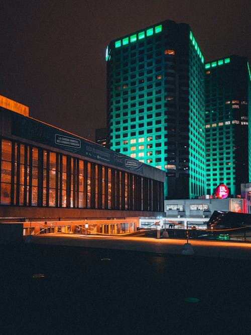 Illuminated Modern Buildings in City at Night 