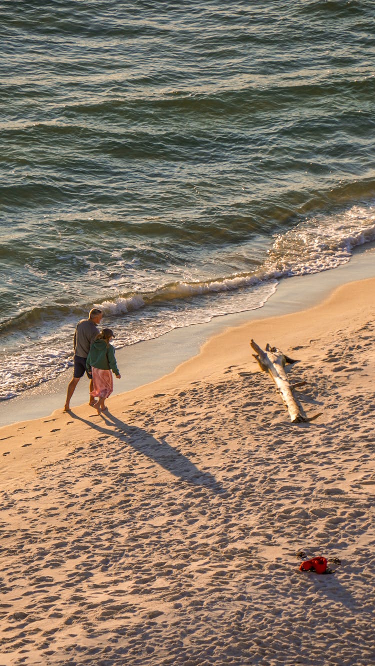 Couple Walking On Beach