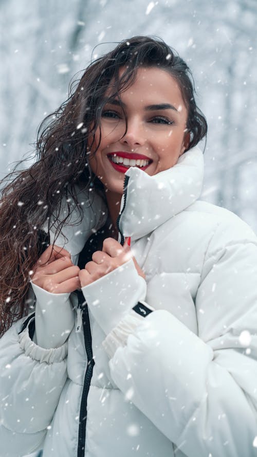 Smiling Brunette in Puffer Jacket in Winter