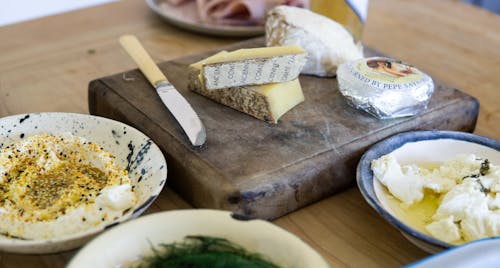 Three Assorted Varieties of Cheese Near Tableknife