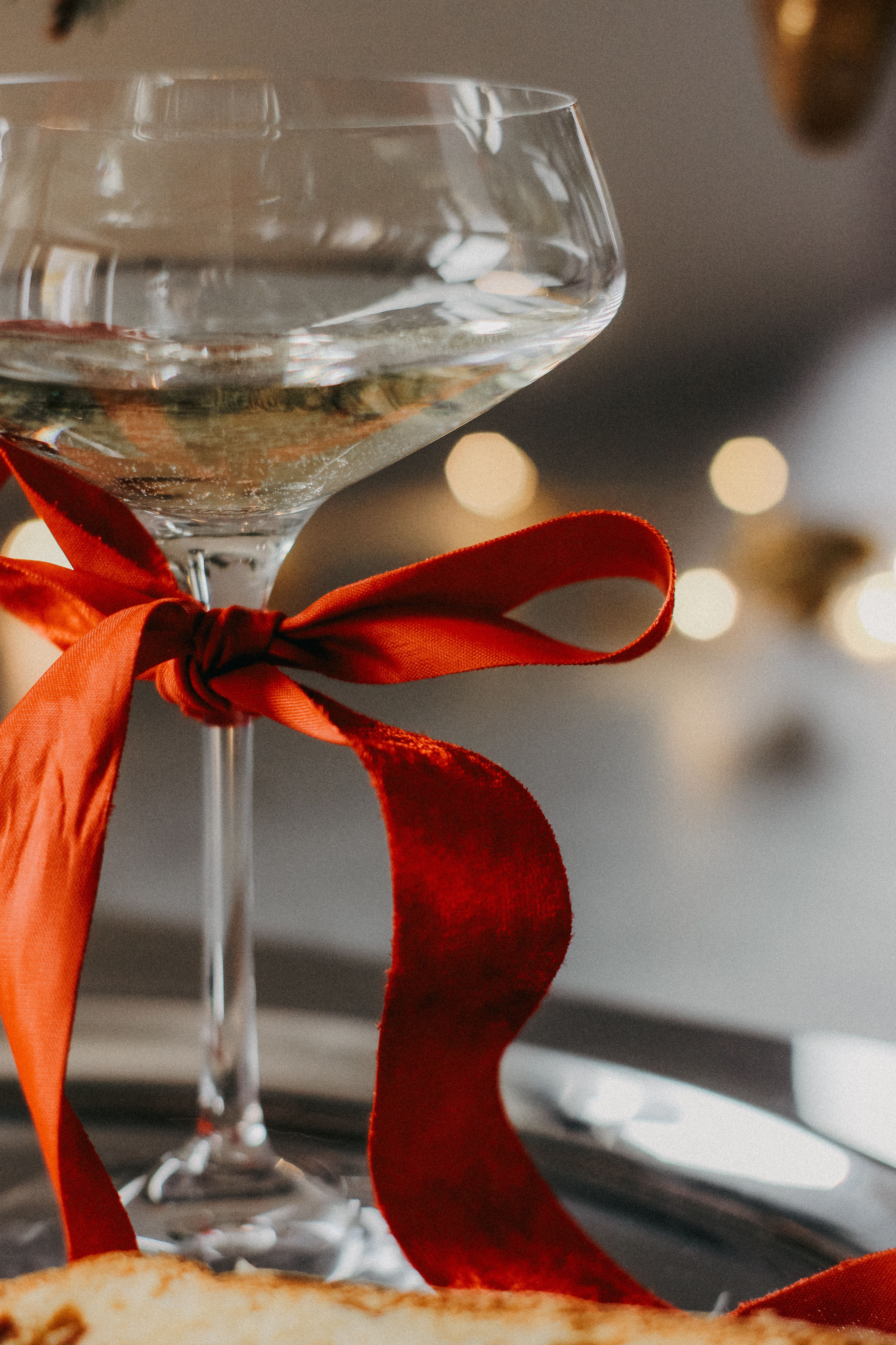 Close-up of an Alcoholic Drink with a Red Ribbon · Free Stock Photo
