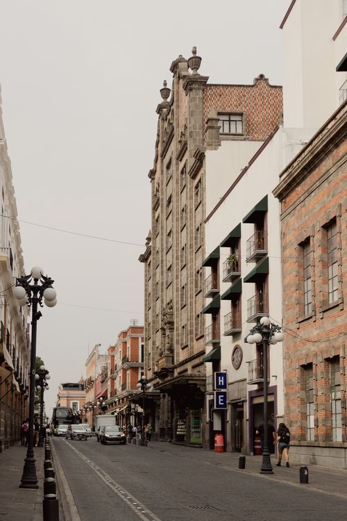 Free Explore the timeless architecture of Puebla, Mexico, featuring elegant urban details and vibrant city life. Stock Photo