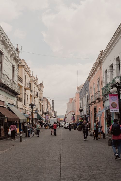 Free A bustling street in Heroica Puebla de Zaragoza, showcasing vibrant local life and architecture. Stock Photo
