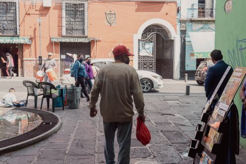 Free A bustling street scene capturing daily life and local architecture in Heroica Puebla de Zaragoza, Mexico. Stock Photo
