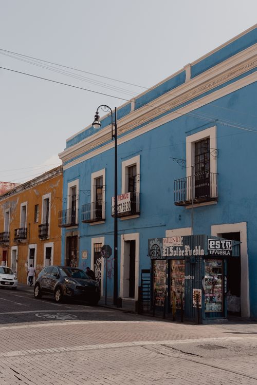 Free Charming colonial architecture on vibrant streets of Puebla, Mexico with colorful buildings. Stock Photo