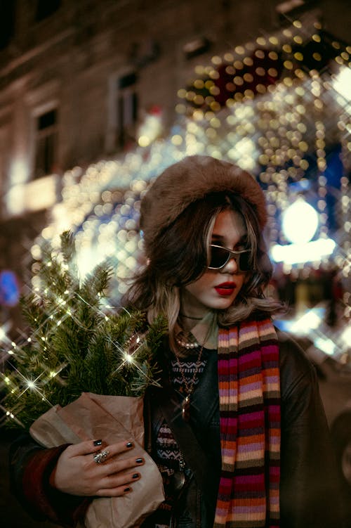 Woman on Illuminated City Street