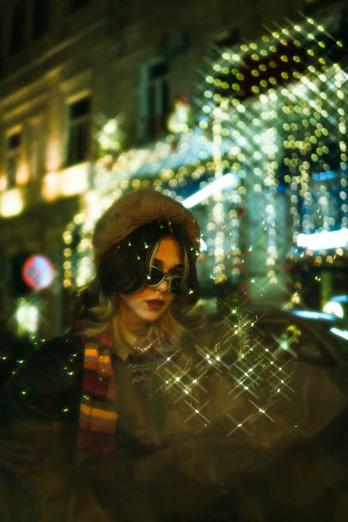 Woman on Illuminated City Street