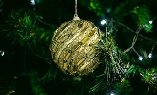 Close-up of a Golden Bauble on a Christmas Tree