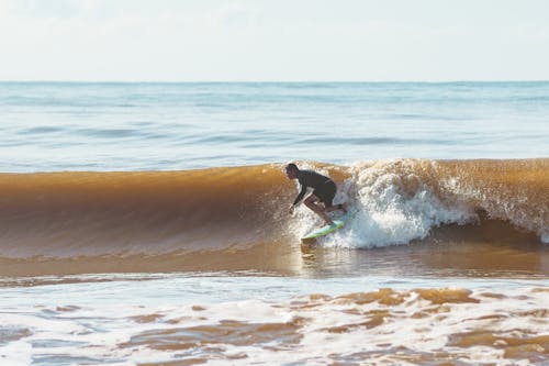 Man Surfing on the Sea 