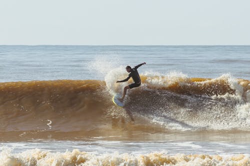 Man Surfing Wave