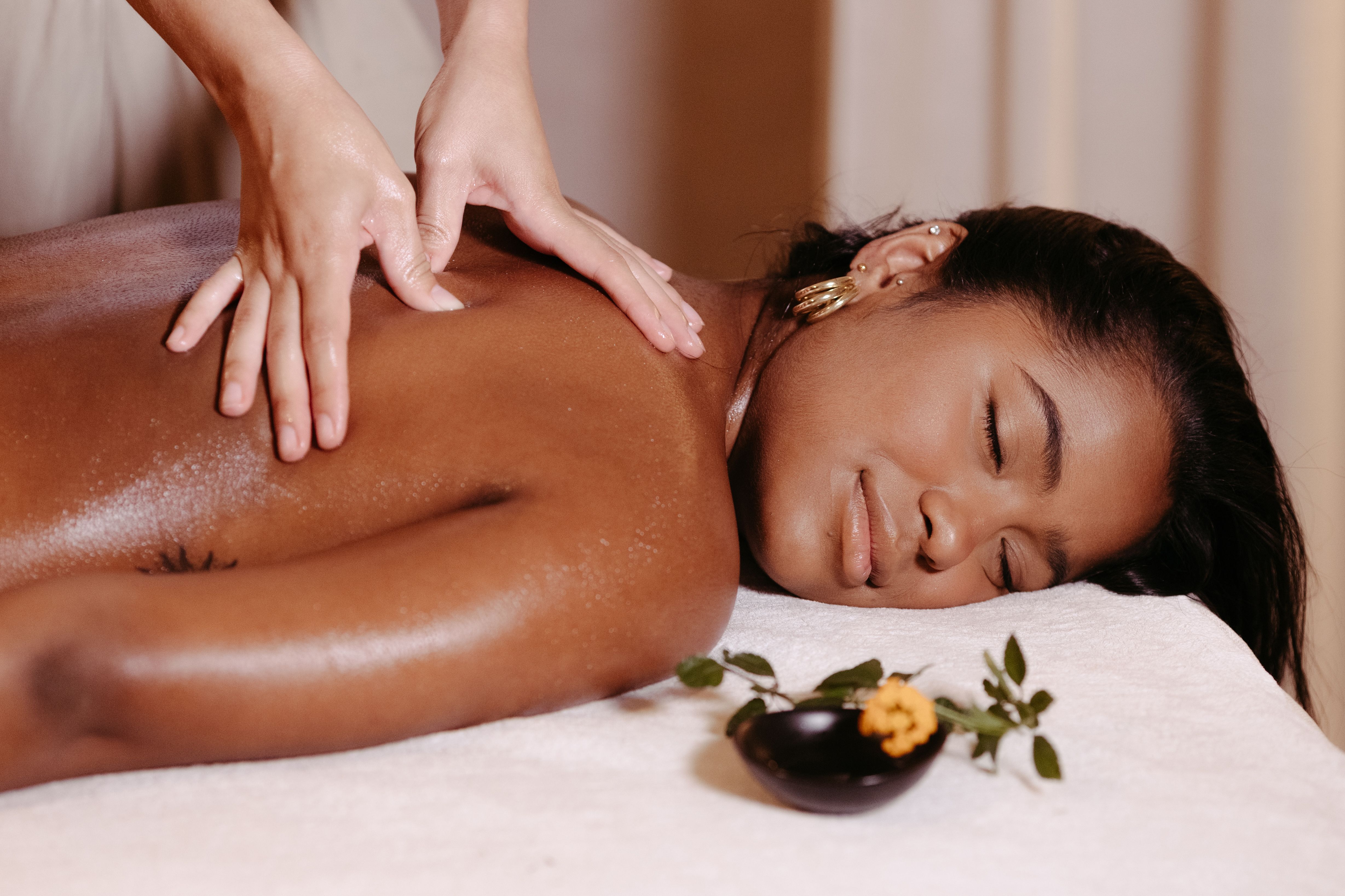 Free Woman Lying Down with Eyes Closed at Massage Stock Photo