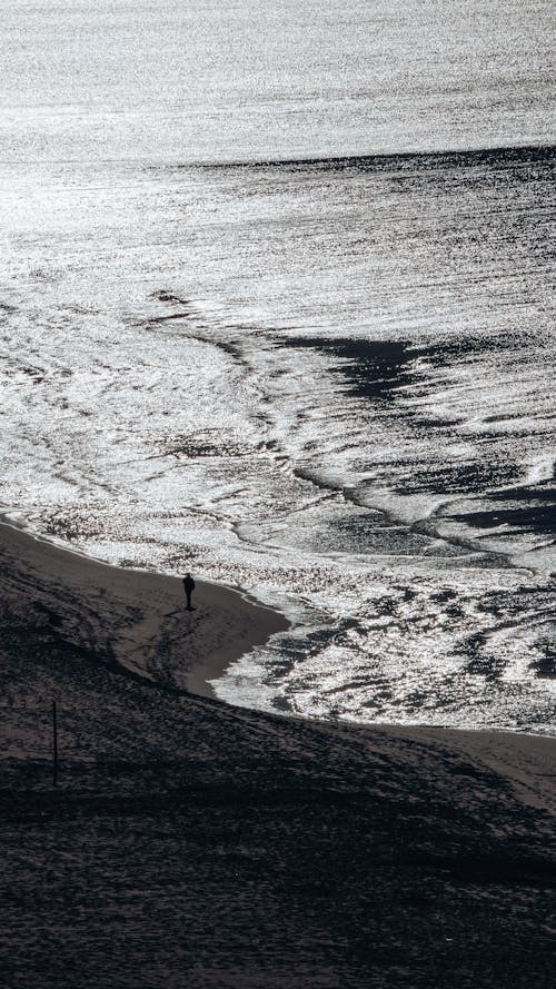 Person Walking Empty Sandy Beach