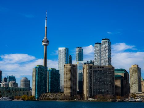 A breathtaking view of Toronto's skyline with the iconic CN Tower captured from across the water.