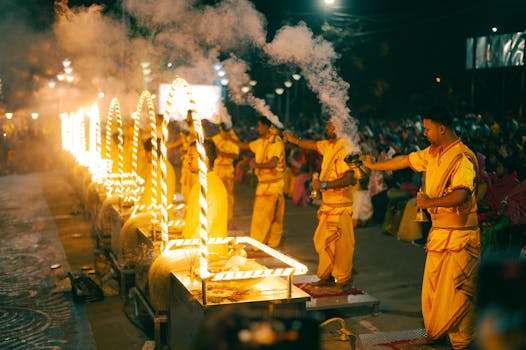 Hindu priests perform the traditional Ganga Aarti ceremony at night on the riverbank.