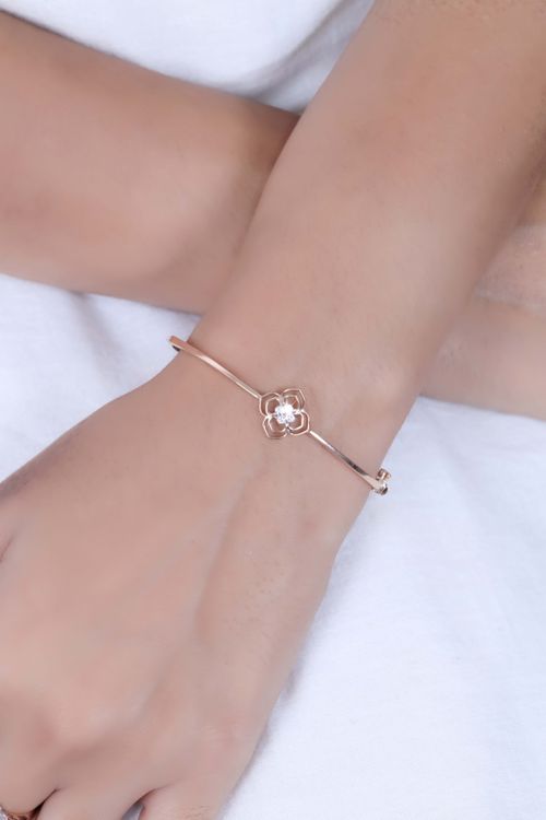 Free Close-up of a delicate bracelet with flower shape on a woman's wrist, highlighting elegance. Stock Photo