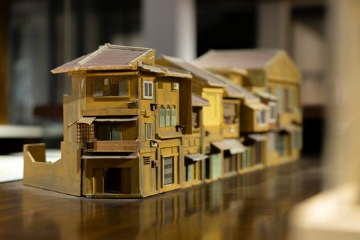 Close-up of an intricately detailed architectural model depicting historic urban houses in a row.