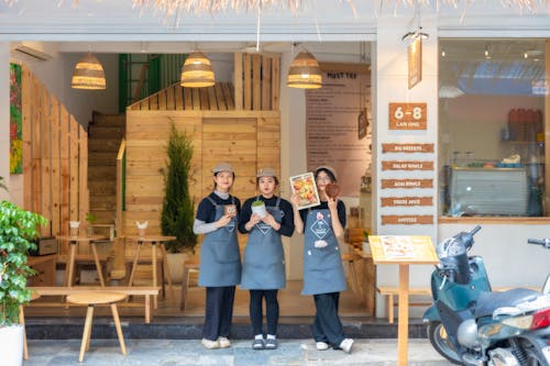 Employees Standing in Front of a Restaurant