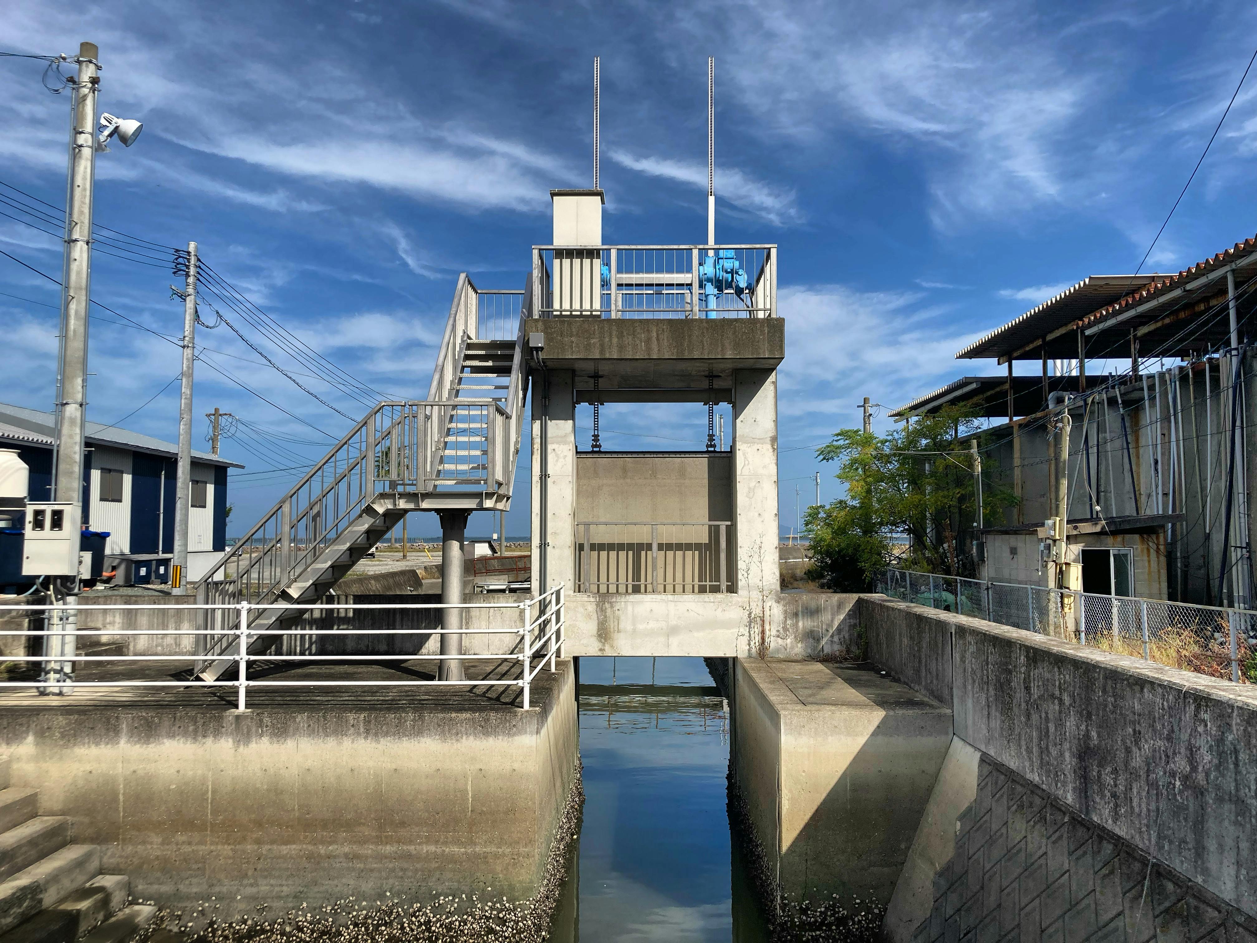 A water control gate structure in an industrial area of Japan.