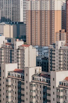 A detailed vertical cityscape highlighting towering urban apartment buildings.