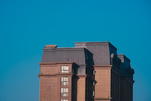 Facade of a Tall Building on the Background of Blue Sky 