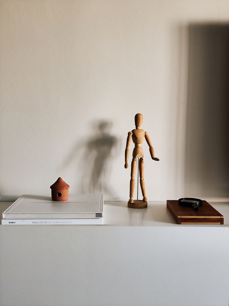 Objects arranged on a minimalist shelf