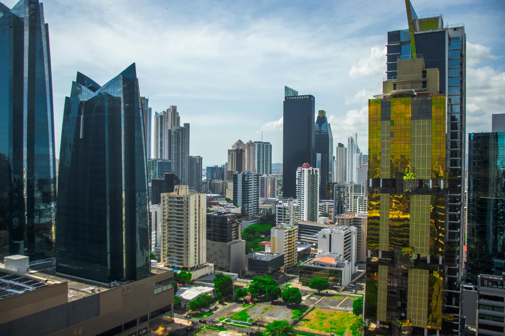 Modern skyscrapers rise in Panama City's financial district on a clear day.