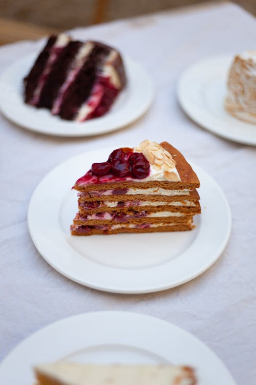 Plates with Different Slices of Cakes