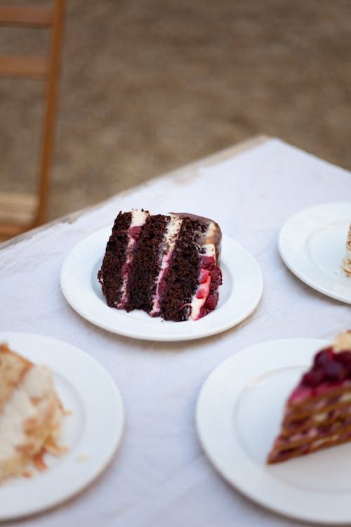 Plates with Different Slices of Cakes