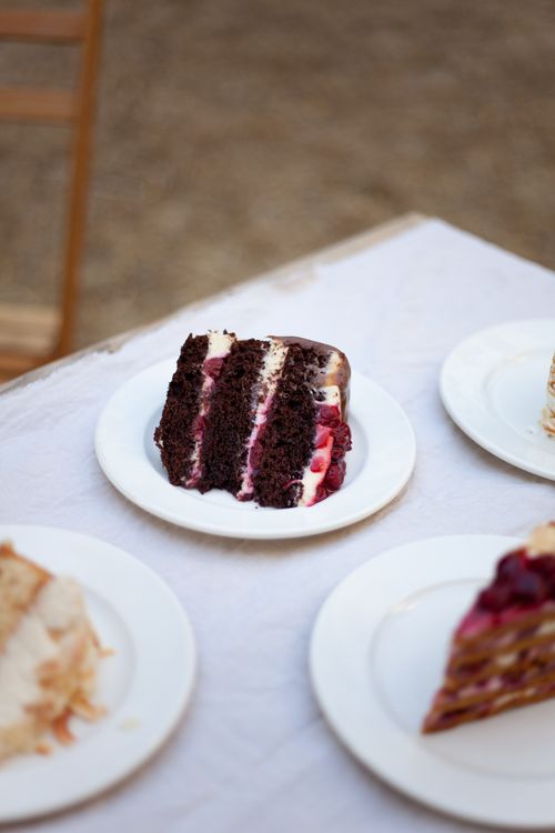 Free A close-up of a chocolate raspberry cake slice on a white plate, perfect for dessert lovers. Stock Photo