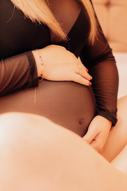 Pregnant Woman Posing Wearing Lingerie