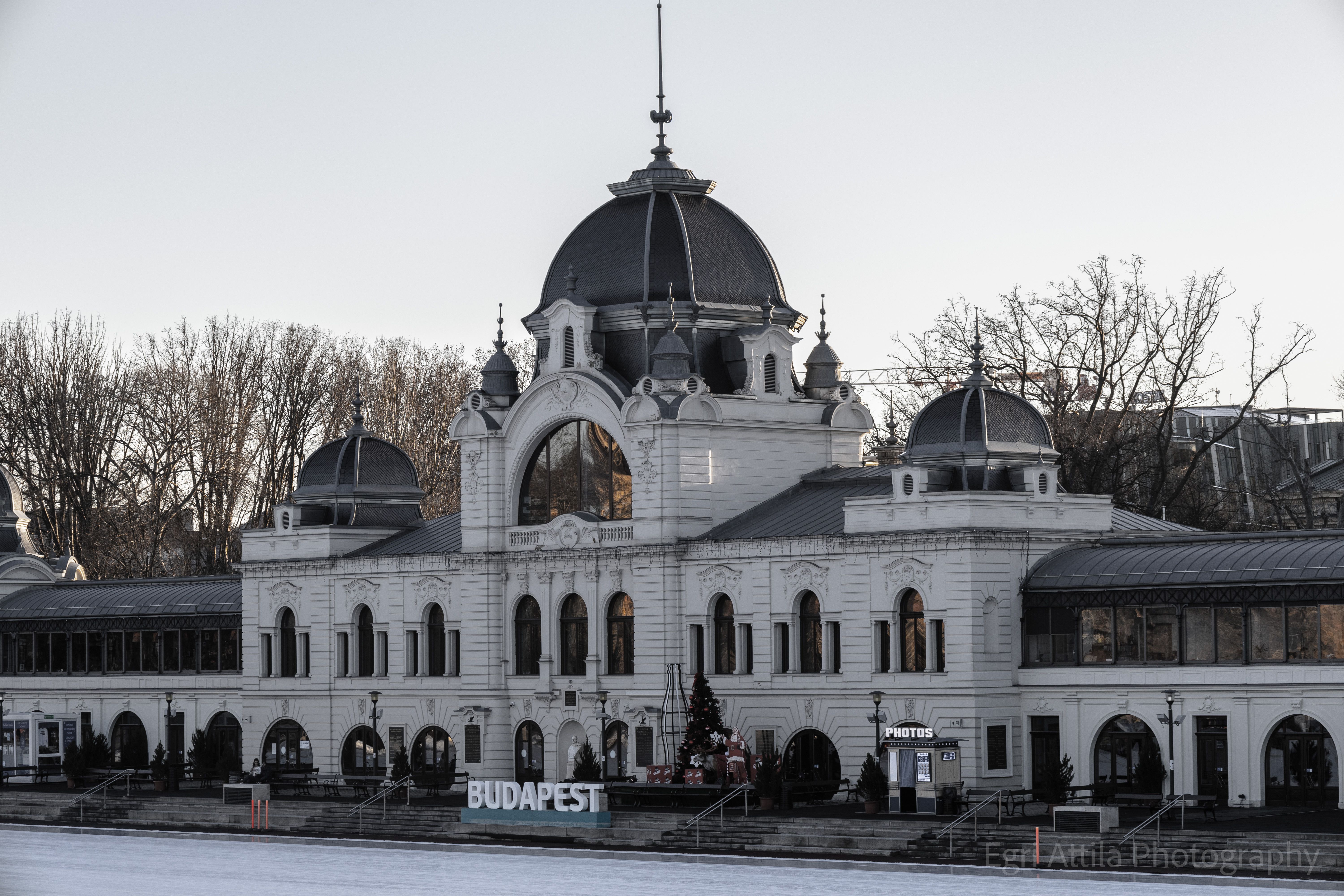 Elegant historic architecture of Budapest's City Park Ice Rink at dusk.