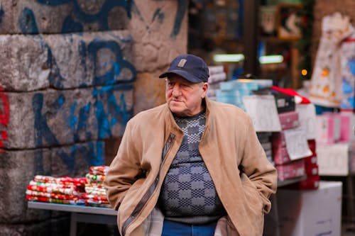 Elderly Man Wearing Cap on a Street Market